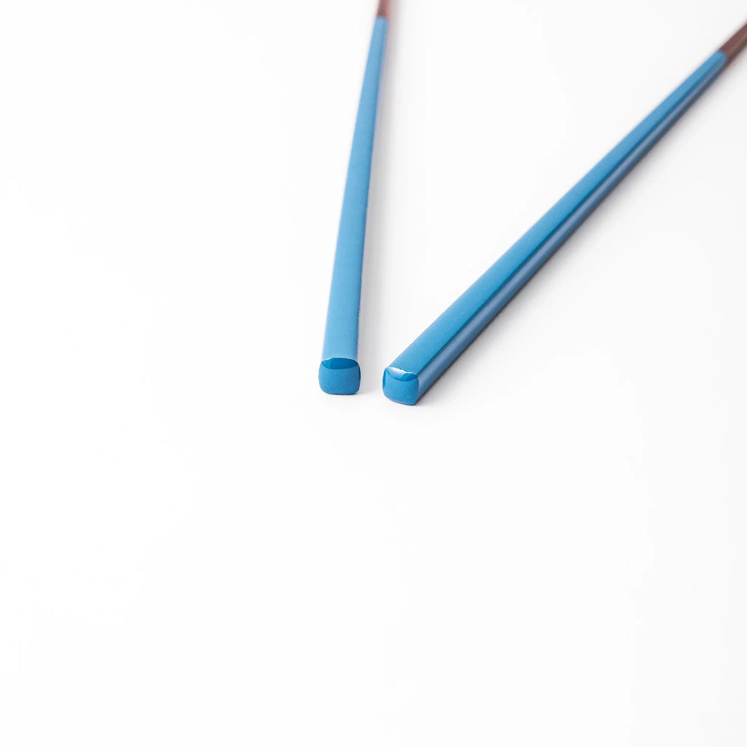Pair of azure blue Japanese traditional color bamboo chopsticks with fine tips for an elegant and precise dining experience