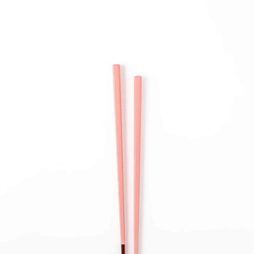 Pair of peach blossom pink Japanese traditional color bamboo chopsticks with fine tips for an elegant and precise dining experience