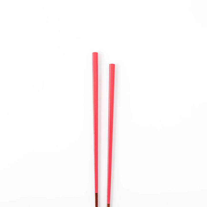 Pair of deep crimson Japanese traditional color bamboo chopsticks with fine tips for an elegant and precise dining experience