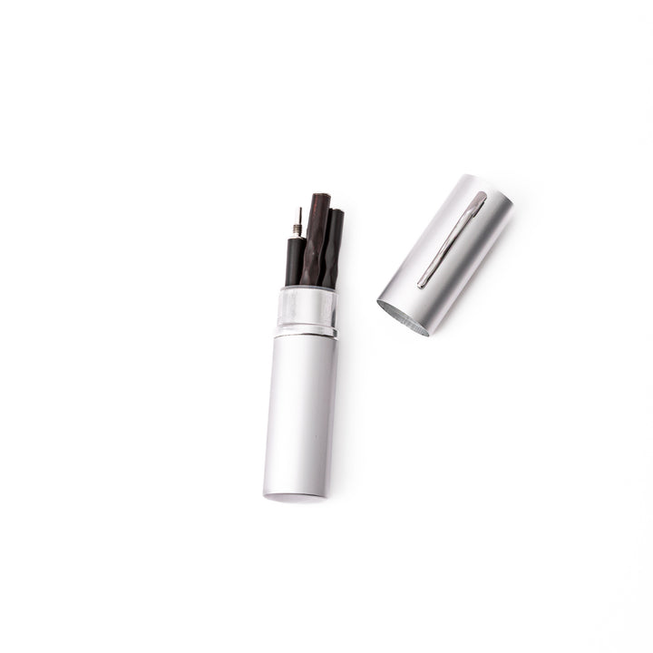 An open silver aluminum travel chopsticks case showing how the detached wooden chopsticks fit perfectly inside