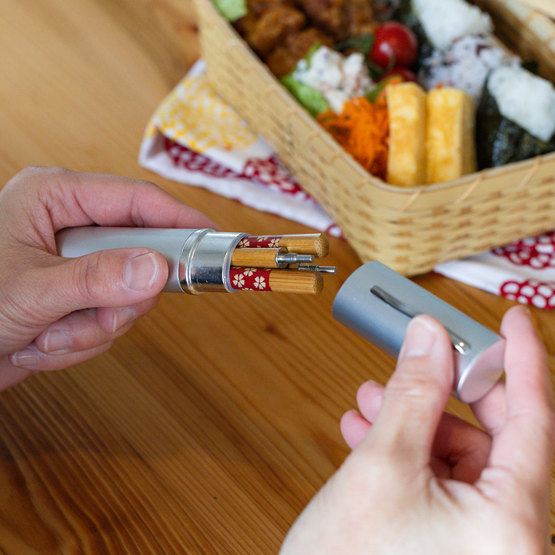 Nami from Just One Cookbook opening an aluminum Japanese travel chopsticks case for a portable bento box lunch