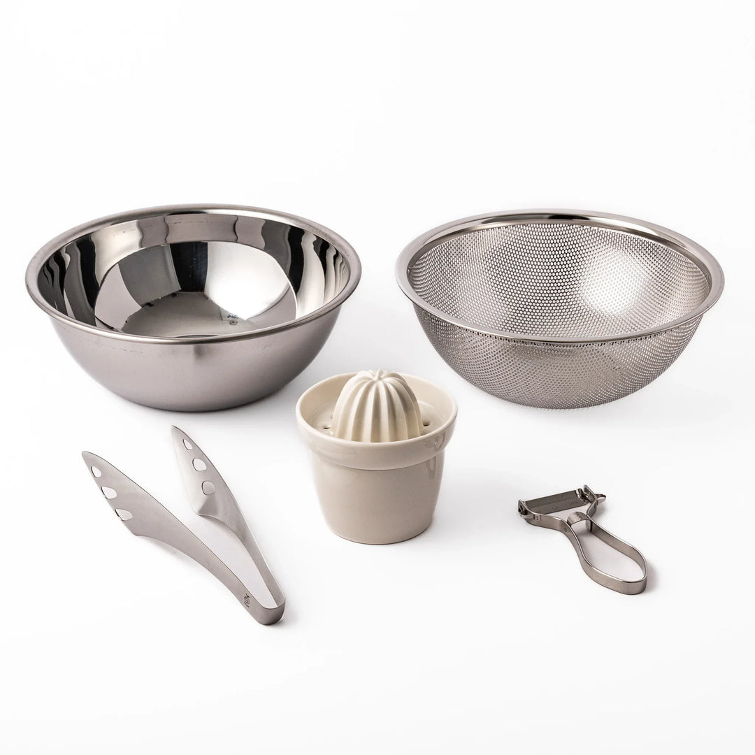 Japanese salad prep set with stainless bowls colander and utensils designed for efficient meal preparation.