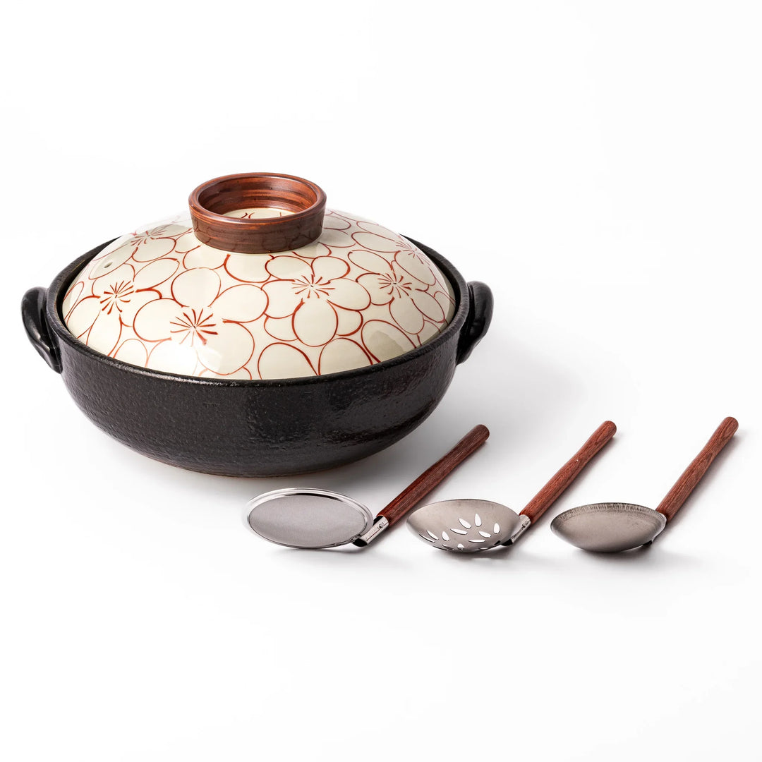 Japanese donabe hot pot set with hand painted floral clay pot and utensils for comforting one pot meals.