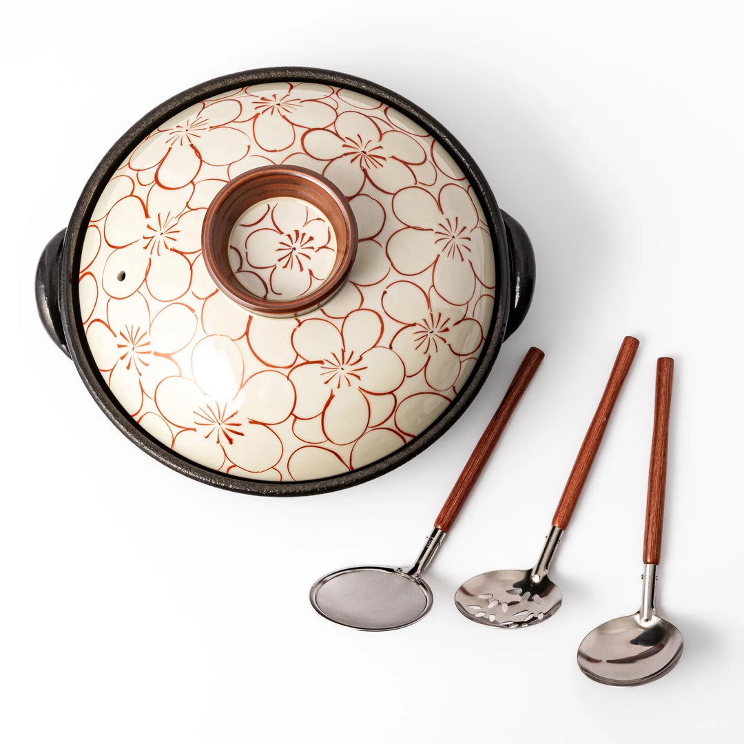 Japanese donabe hot pot set with hand painted floral clay pot and utensils for comforting one pot meals.