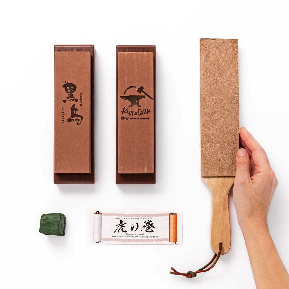 Japanese knife maintenance kit with whetstones leather strop and polishing compound for sharpening blades.
