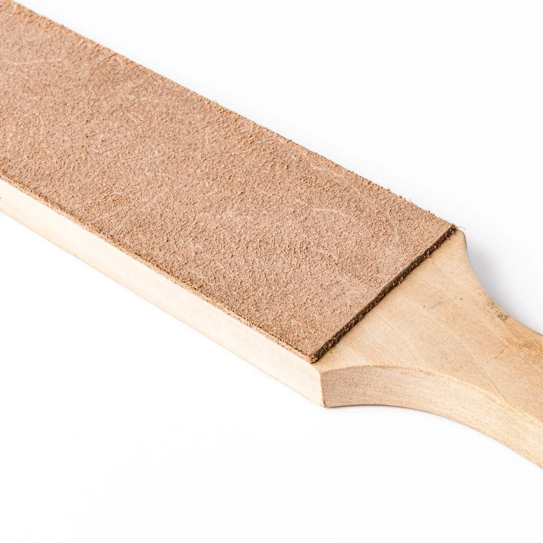 Japanese knife maintenance kit with whetstones leather strop and polishing compound for sharpening blades.