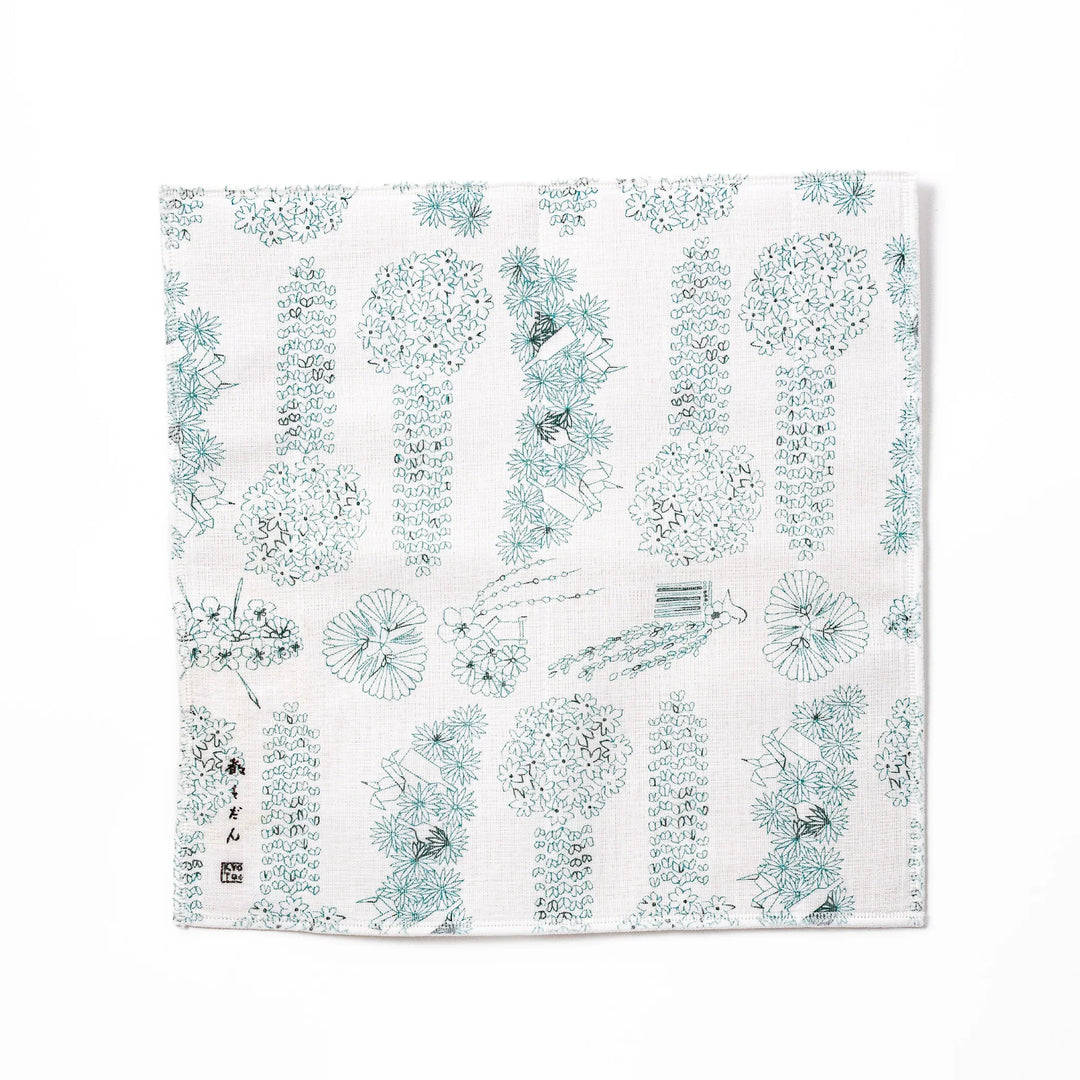 Kyoto Yuzen dyed Kaya cotton kitchen cloth with a green Japanese hair ornament pattern on white fabric
