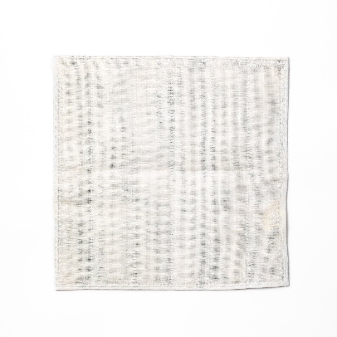 Kyoto Yuzen dyed Kaya cotton kitchen cloth with a green Japanese hair ornament pattern on white fabric