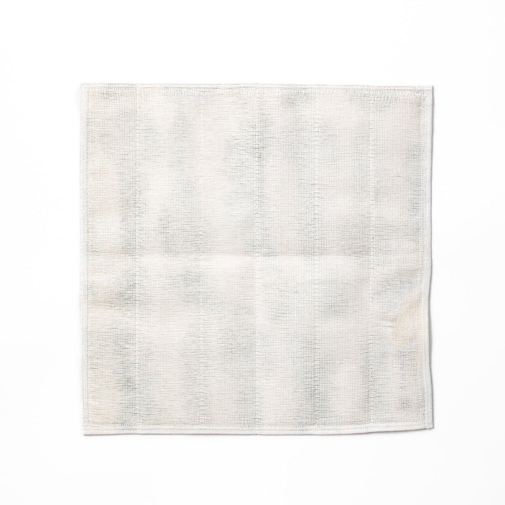 Kyoto Yuzen dyed Kaya cotton kitchen cloth with a green Japanese hair ornament pattern on white fabric