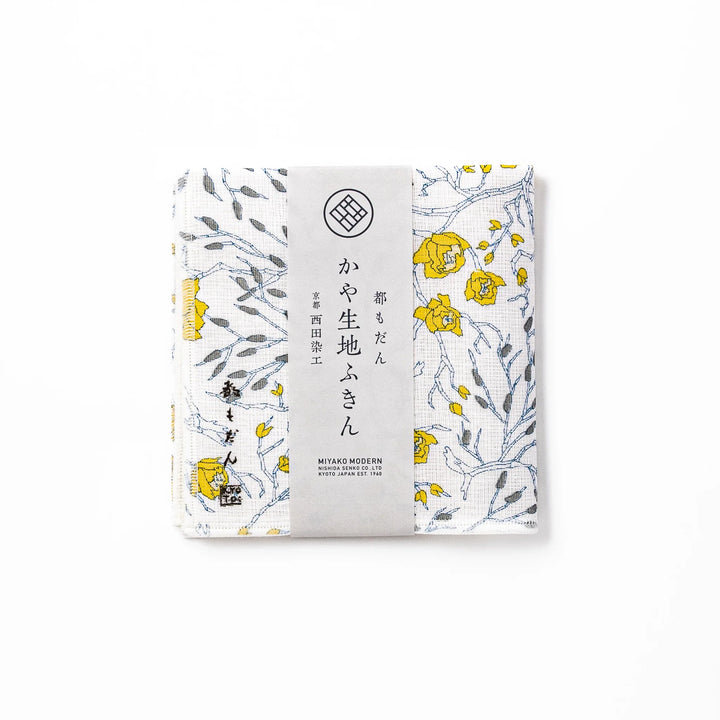 Kyoto Yuzen dyed Kaya cotton kitchen cloth featuring a bright yellow Japanese wintersweet floral pattern on white fabric