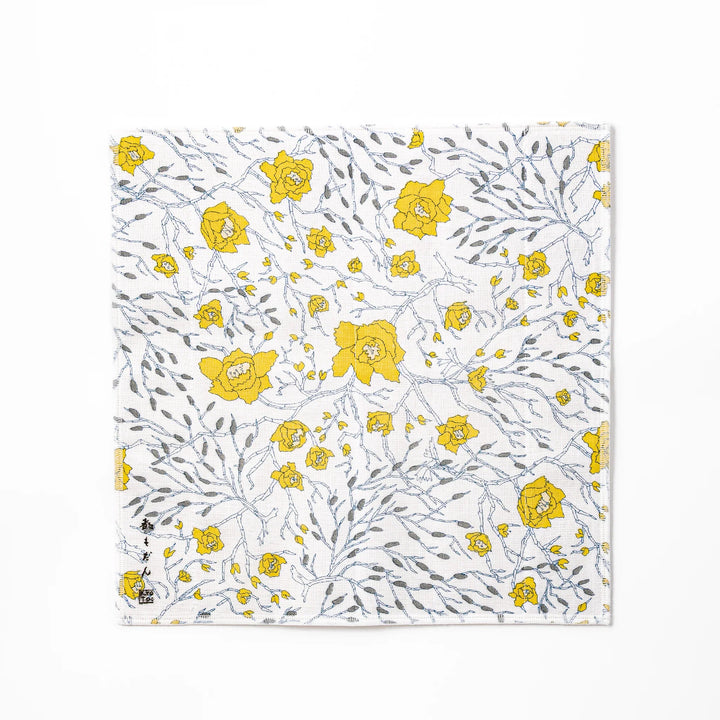 Kyoto Yuzen dyed Kaya cotton kitchen cloth featuring a bright yellow Japanese wintersweet floral pattern on white fabric