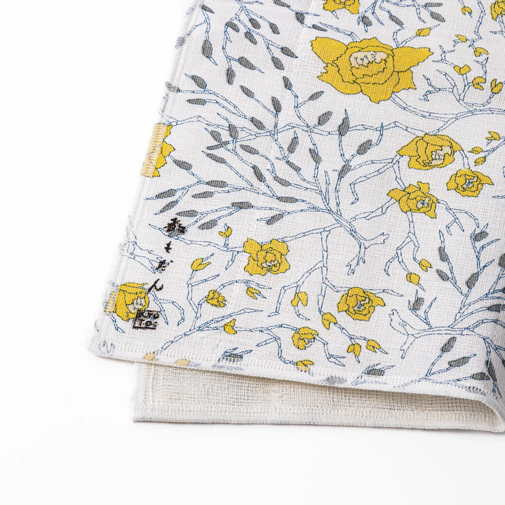 Kyoto Yuzen dyed Kaya cotton kitchen cloth featuring a bright yellow Japanese wintersweet floral pattern on white fabric