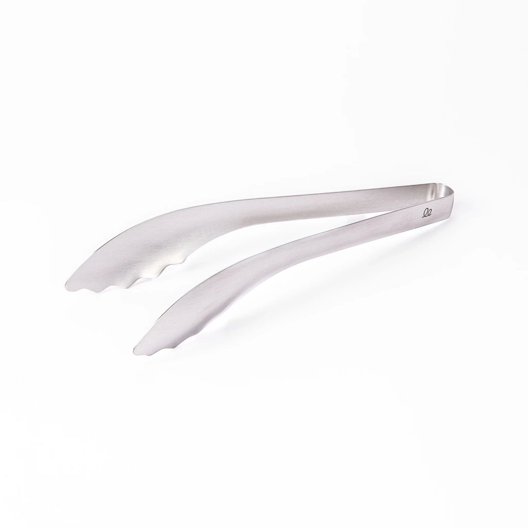 Japanese stainless steel kitchen tongs with slim curved tips for precise serving and plating