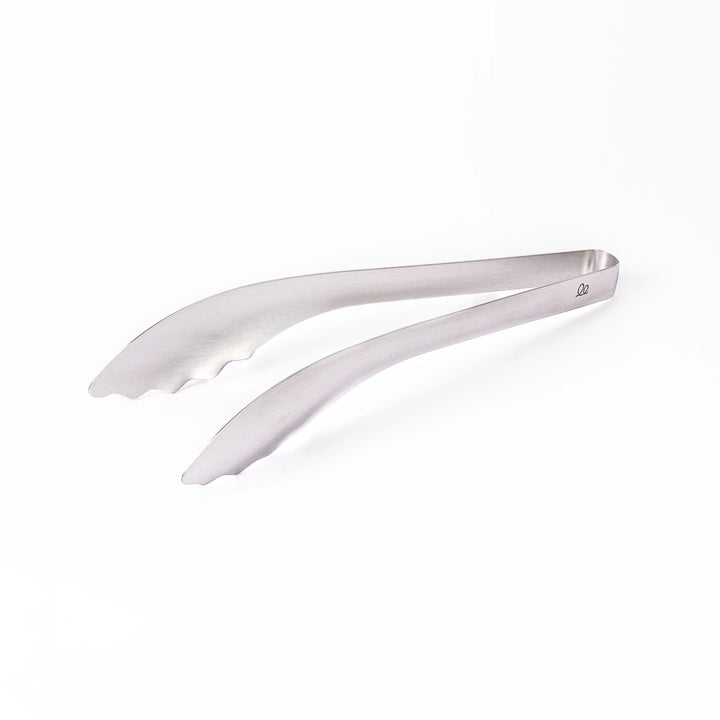 Japanese stainless steel kitchen tongs with slim curved tips for precise serving and plating