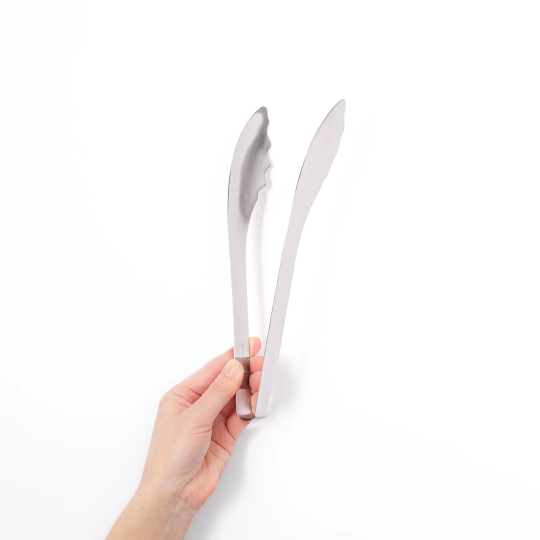 Japanese stainless steel kitchen tongs with slim curved tips for precise serving and plating