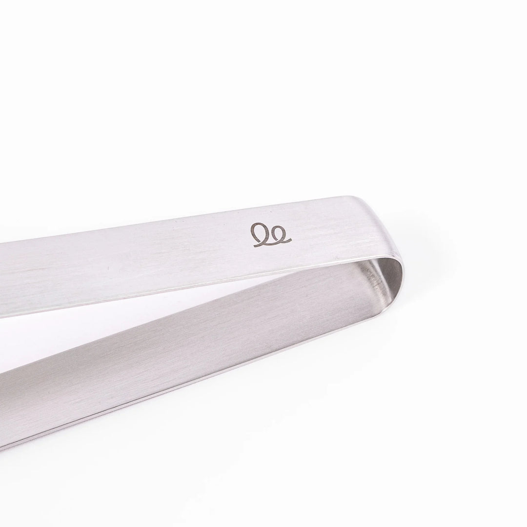 Japanese stainless steel kitchen tongs with slim curved tips for precise serving and plating