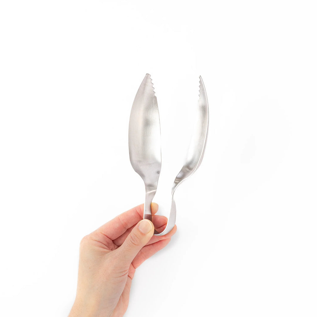 Japanese stainless steel ice scoop tongs with serrated edges and ergonomic curved design for secure grip and easy handling
