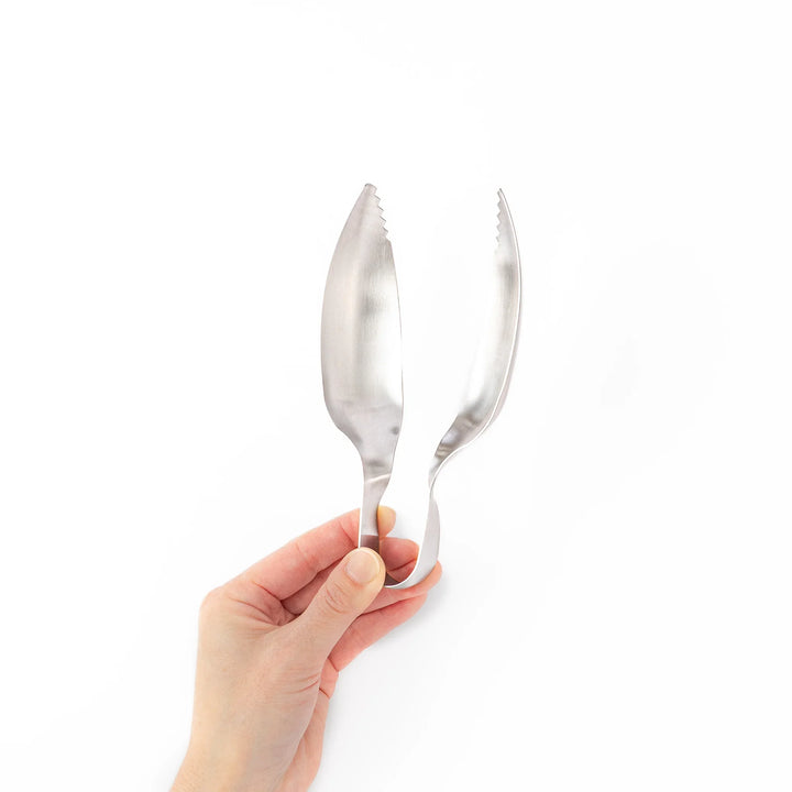 Japanese stainless steel ice scoop tongs with serrated edges and ergonomic curved design for secure grip and easy handling