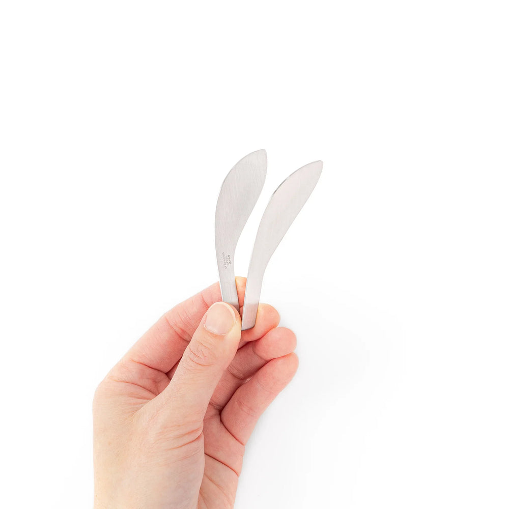 Japanese stainless steel precision fingertip tongs with slim curved tips and brushed finish for delicate plating