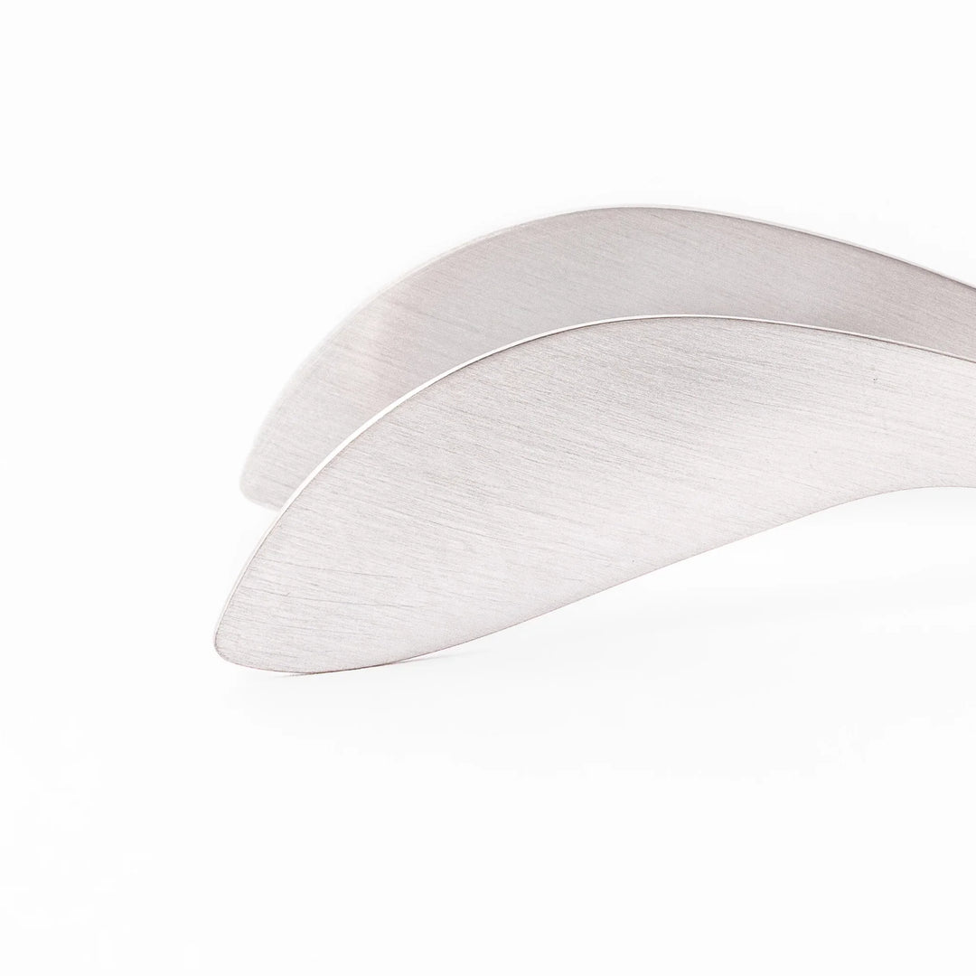 Japanese stainless steel precision fingertip tongs with slim curved tips and brushed finish for delicate plating