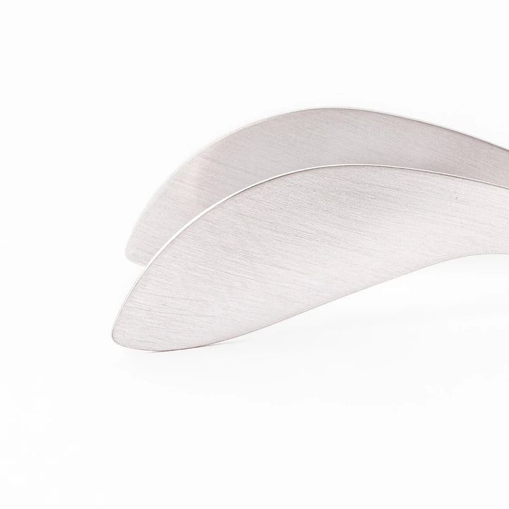 Japanese stainless steel precision fingertip tongs with slim curved tips and brushed finish for delicate plating