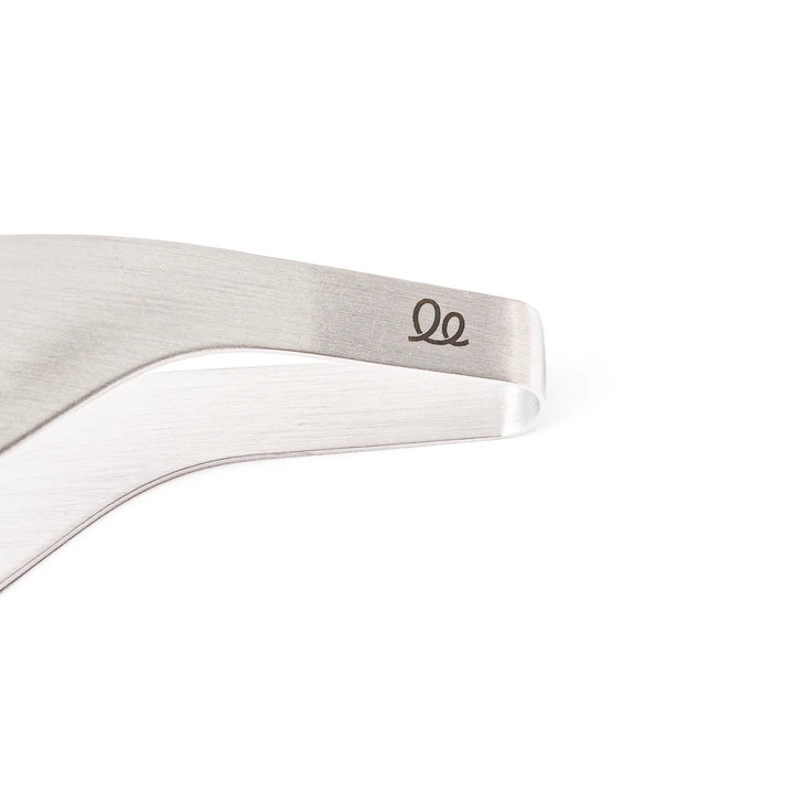 Japanese stainless steel precision fingertip tongs with slim curved tips and brushed finish for delicate plating