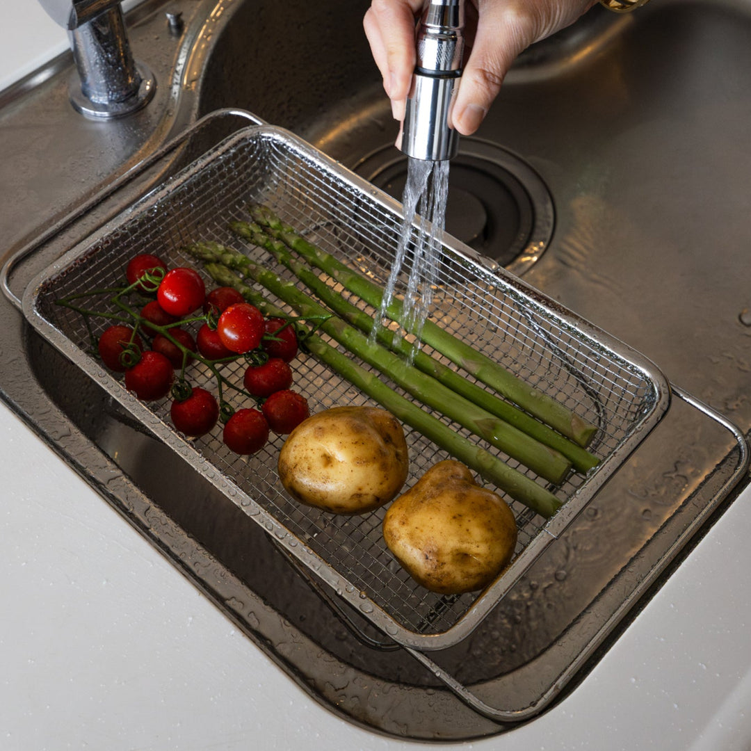 Nami from Just One Cookbook washing fresh tomatoes asparagus and potatoes in a stainless steel expandable draining basket