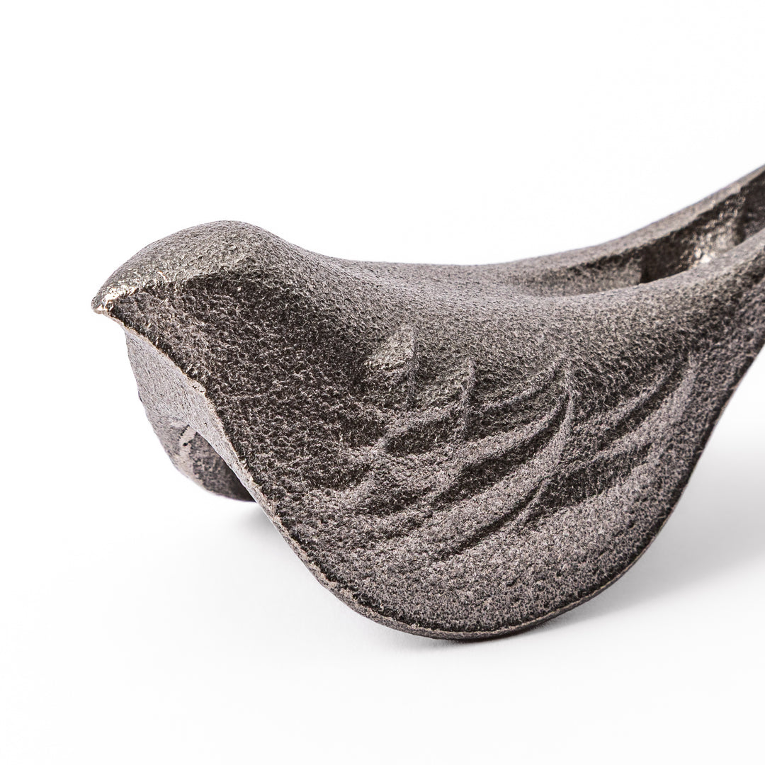 Little Bird Japanese Cast Iron Fish for boiling water to add iron supplement displayed on a plain white background