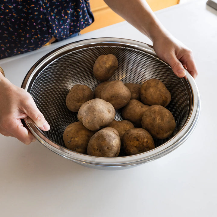 Extra large Japanese stainless steel mesh colander and bowl, perfect for holding a large batch of potatoes