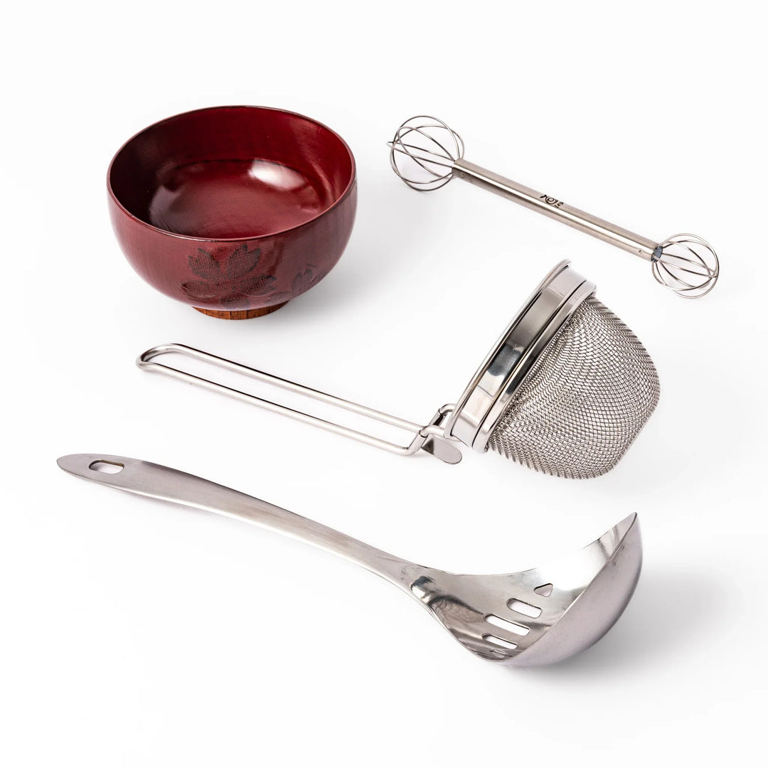 Japanese bento set with wooden lunch box onigiri mold grill mesh and tongs for easy homemade lunches.