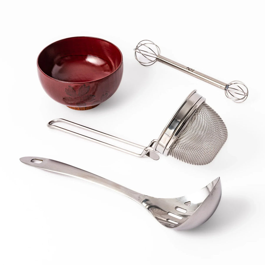 Japanese bento set with wooden lunch box onigiri mold grill mesh and tongs for easy homemade lunches.