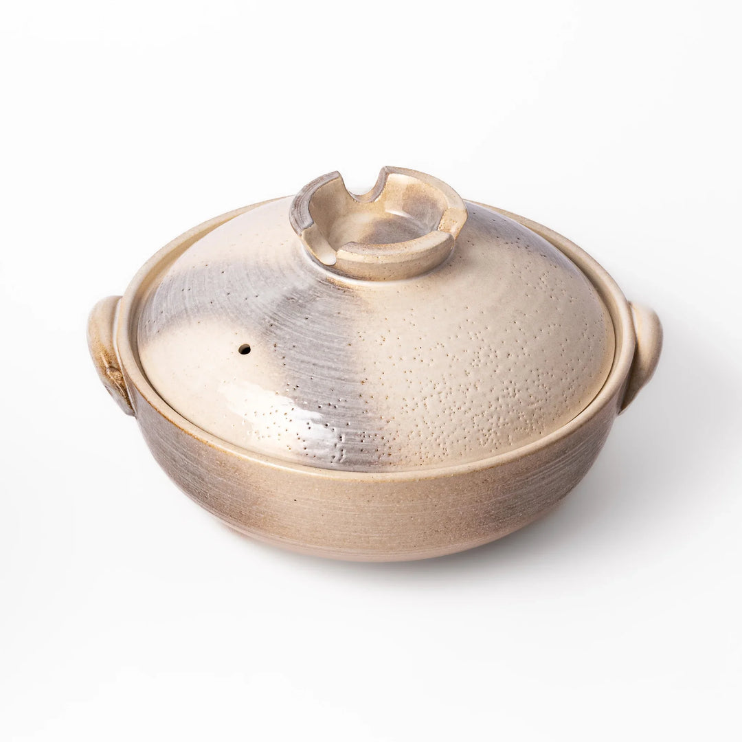 Japanese donabe clay pot with misty beige glazed lid and handles ideal for family hot pot and slow cooking.