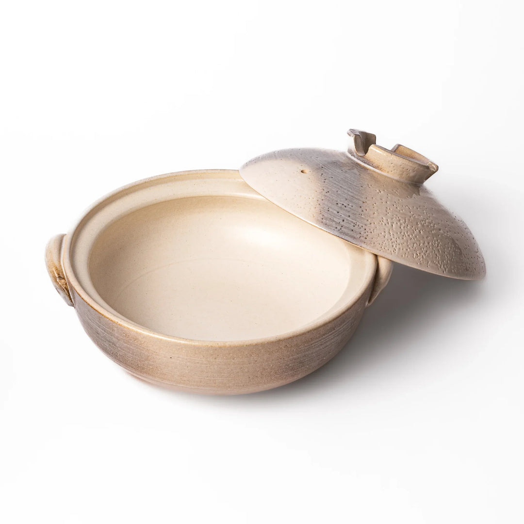 Japanese donabe clay pot with misty beige glazed lid and handles ideal for family hot pot and slow cooking.