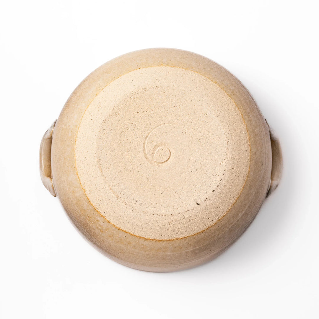 Japanese donabe clay pot with misty beige glazed lid and handles ideal for family hot pot and slow cooking.