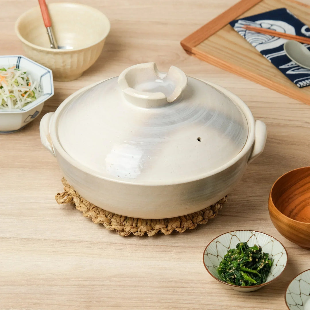 Traditional Japanese donabe clay pot with lid, ideal for hot pot and slow cooking, blending function and timeless design.