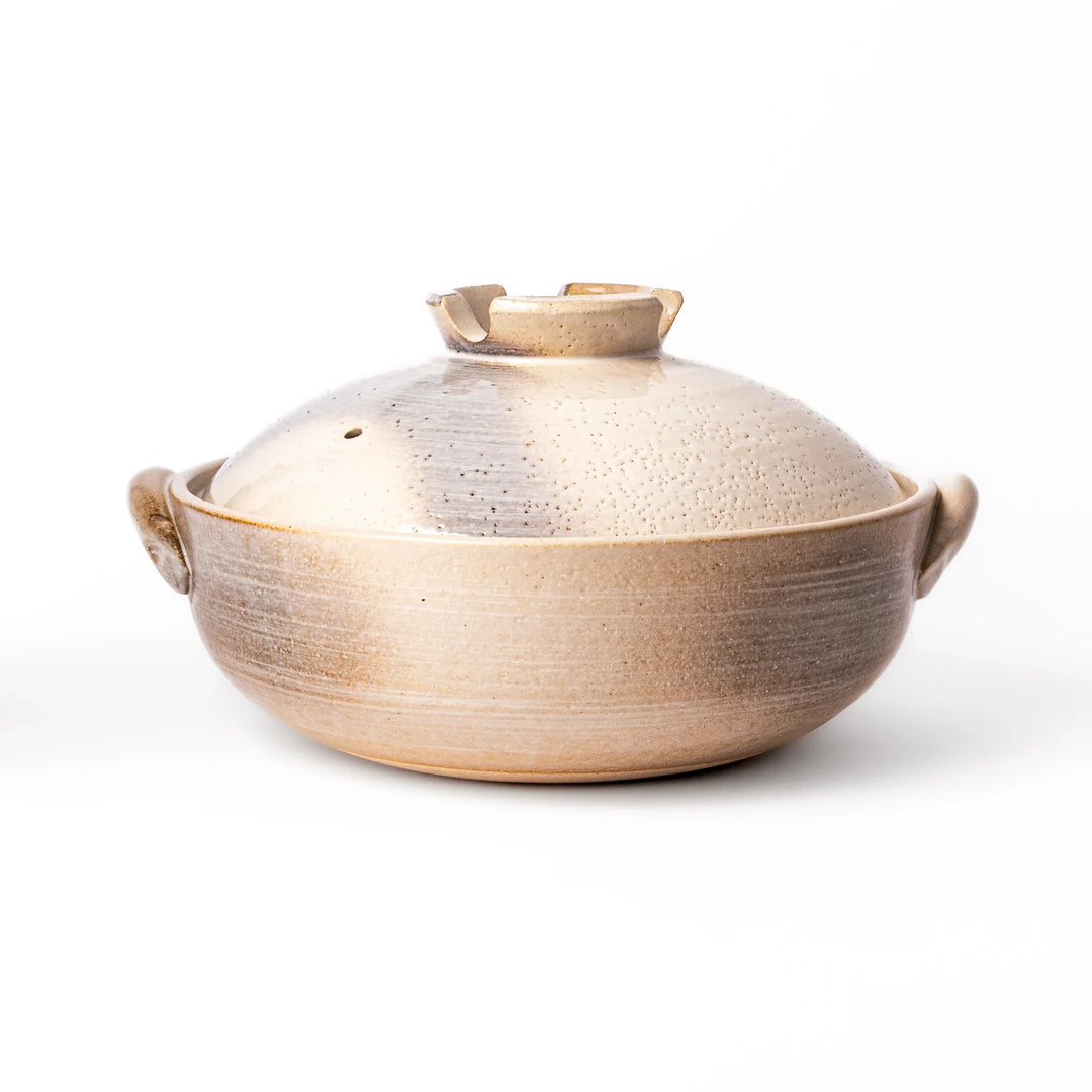 Japanese donabe clay pot with misty beige glazed lid and handles ideal for family hot pot and slow cooking.