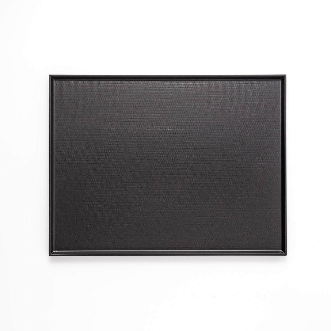 Modern Japanese black lacquer serving tray with horizontal grain texture and side grooves for easy use.