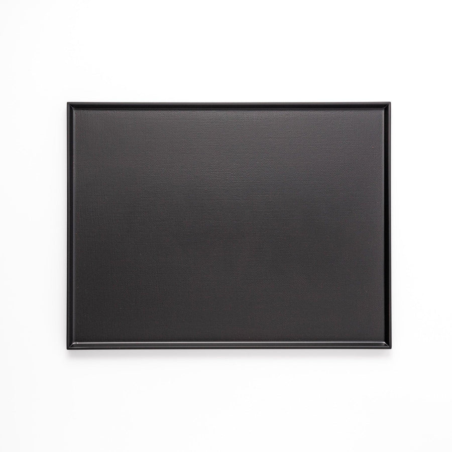 Modern Japanese black lacquer serving tray with horizontal grain texture and side grooves for easy use.