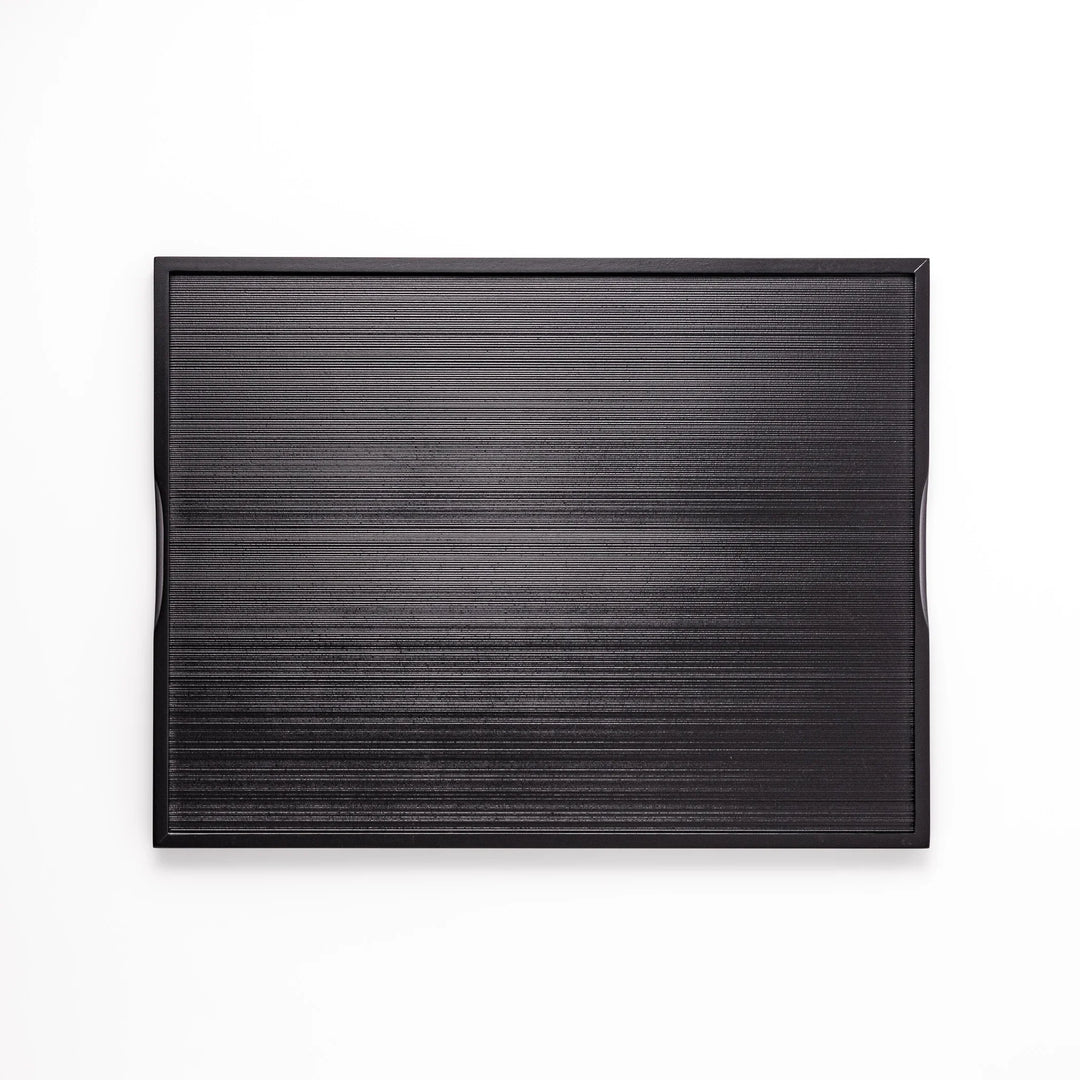 Modern Japanese black lacquer serving tray with horizontal grain texture and side grooves for easy use.
