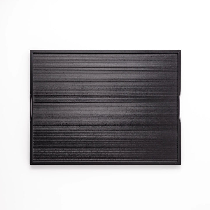Modern Japanese black lacquer serving tray with horizontal grain texture and side grooves for easy use.