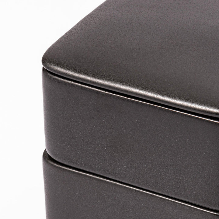 Sleek black Japanese porcelain two tier bento box set with minimalist design for modern meal presentation.