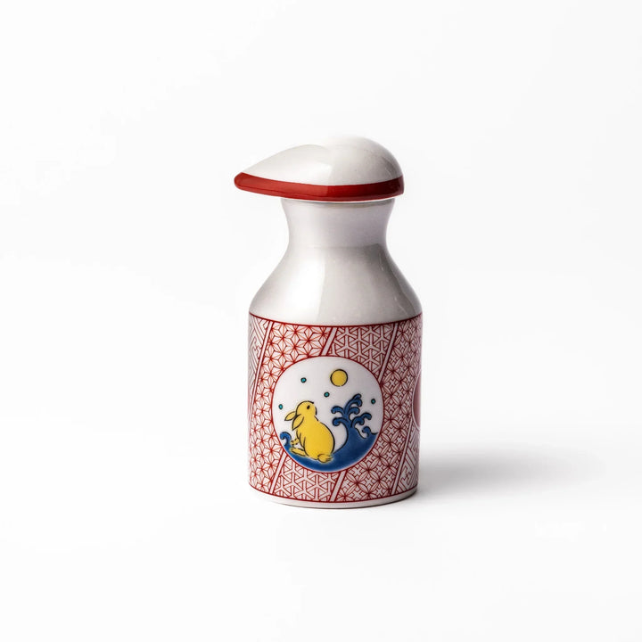 Japanese ceramic soy sauce dispenser with red geometric pattern and moon rabbit motif for elegant dining.
