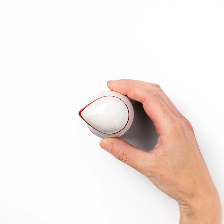 Japanese ceramic soy sauce dispenser with red geometric pattern and moon rabbit motif for elegant dining.