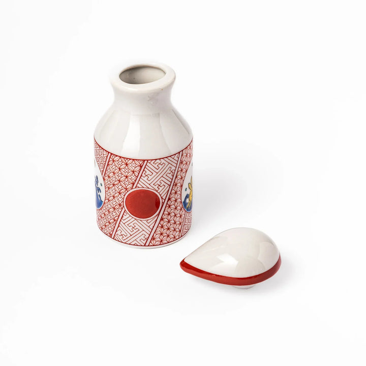 Japanese ceramic soy sauce dispenser with red geometric pattern and moon rabbit motif for elegant dining.
