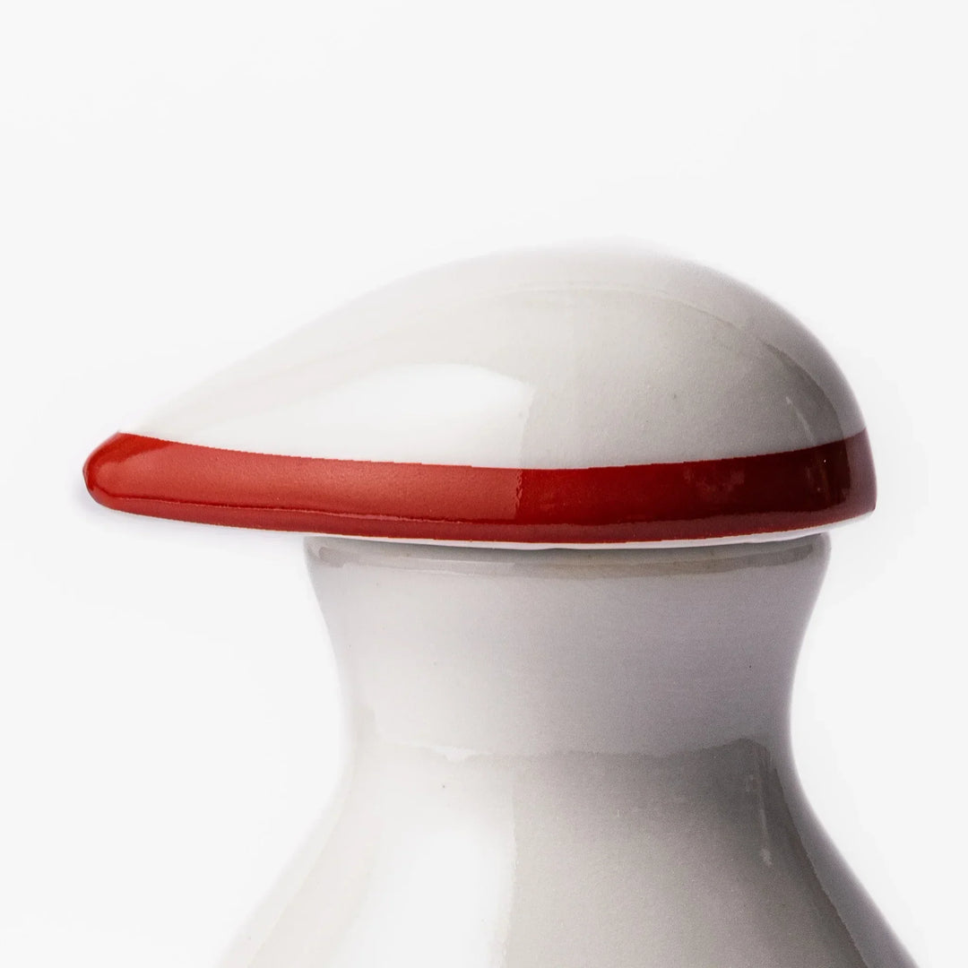 Japanese ceramic soy sauce dispenser with red geometric pattern and moon rabbit motif for elegant dining.