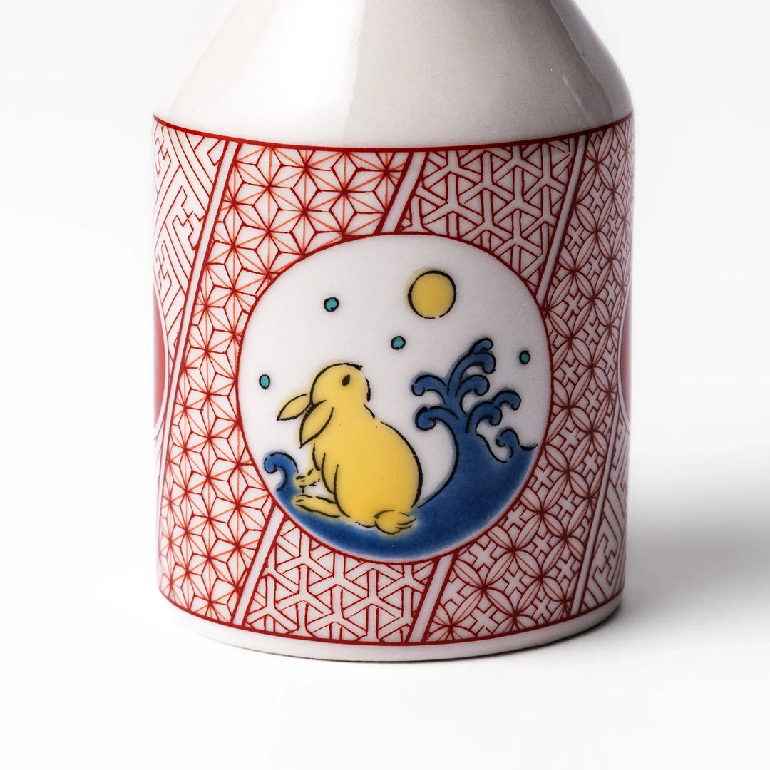 Japanese ceramic soy sauce dispenser with red geometric pattern and moon rabbit motif for elegant dining.
