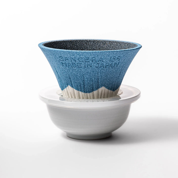 Sky blue Mount Fuji ceramic coffee filter with snowy peak handcrafted in Japan for reusable pour over brewing.