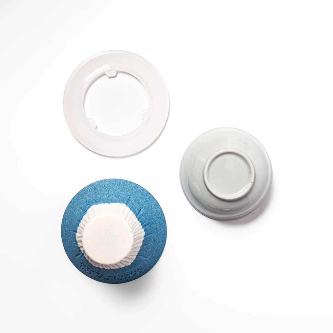 Sky blue Mount Fuji ceramic coffee filter with snowy peak handcrafted in Japan for reusable pour over brewing.