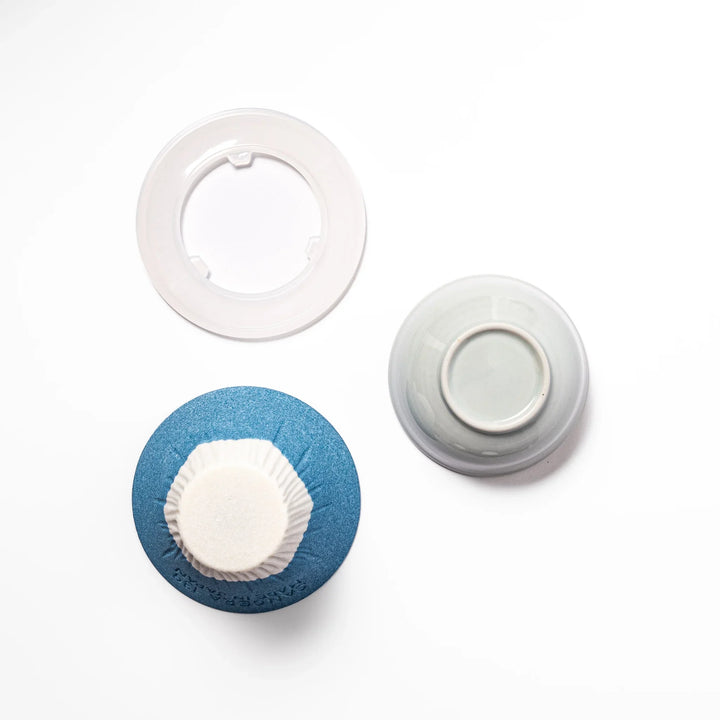 Sky blue Mount Fuji ceramic coffee filter with snowy peak handcrafted in Japan for reusable pour over brewing.