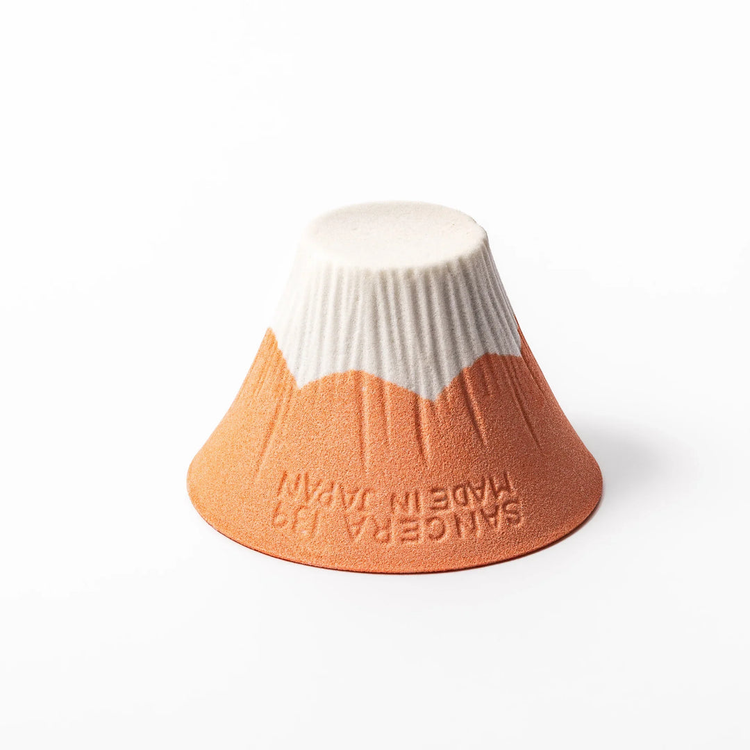 Orange Mount Fuji ceramic coffee filter with snowy peak handcrafted in Japan for modern pour over brewing.